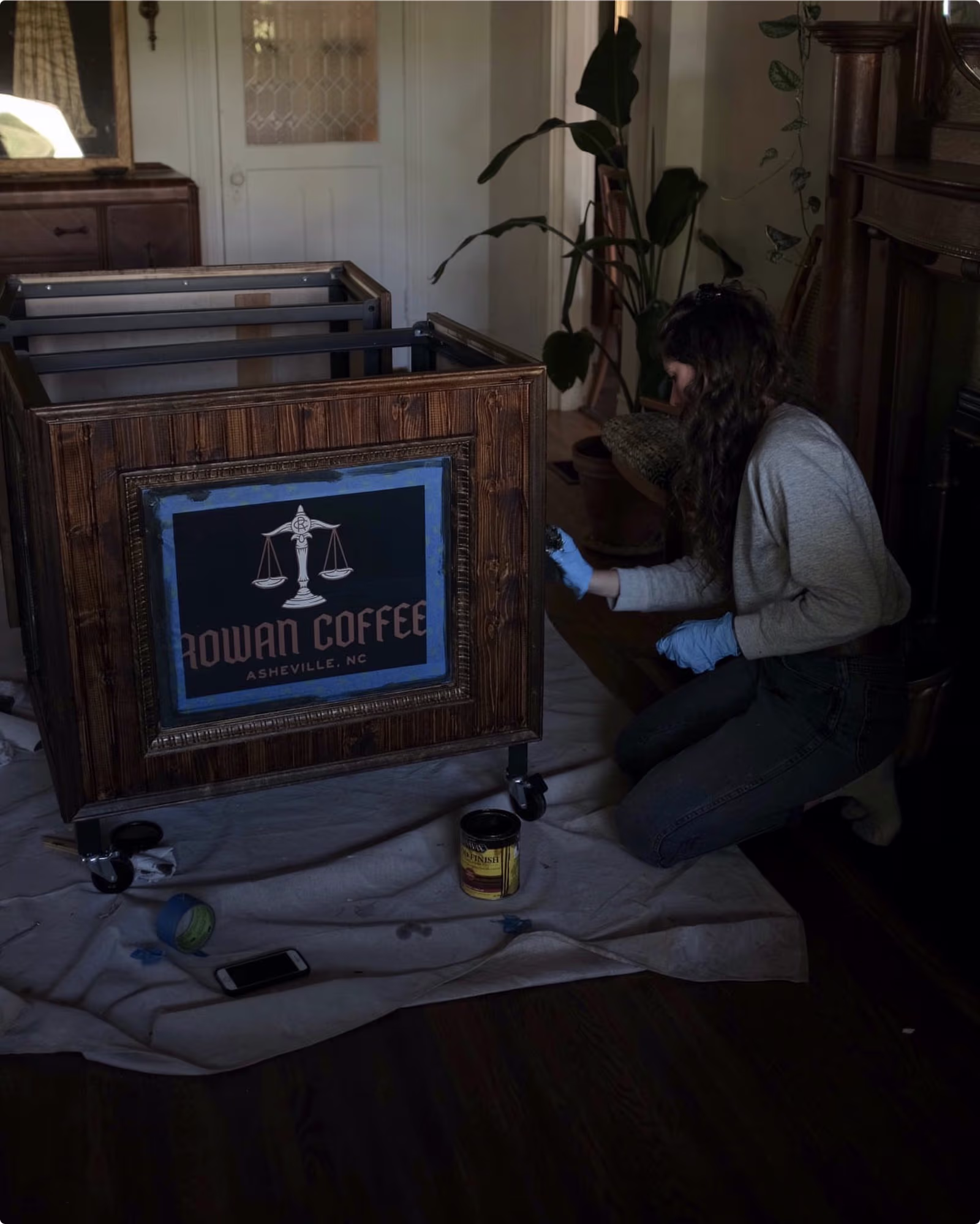 A dark coffee cart with wood panels